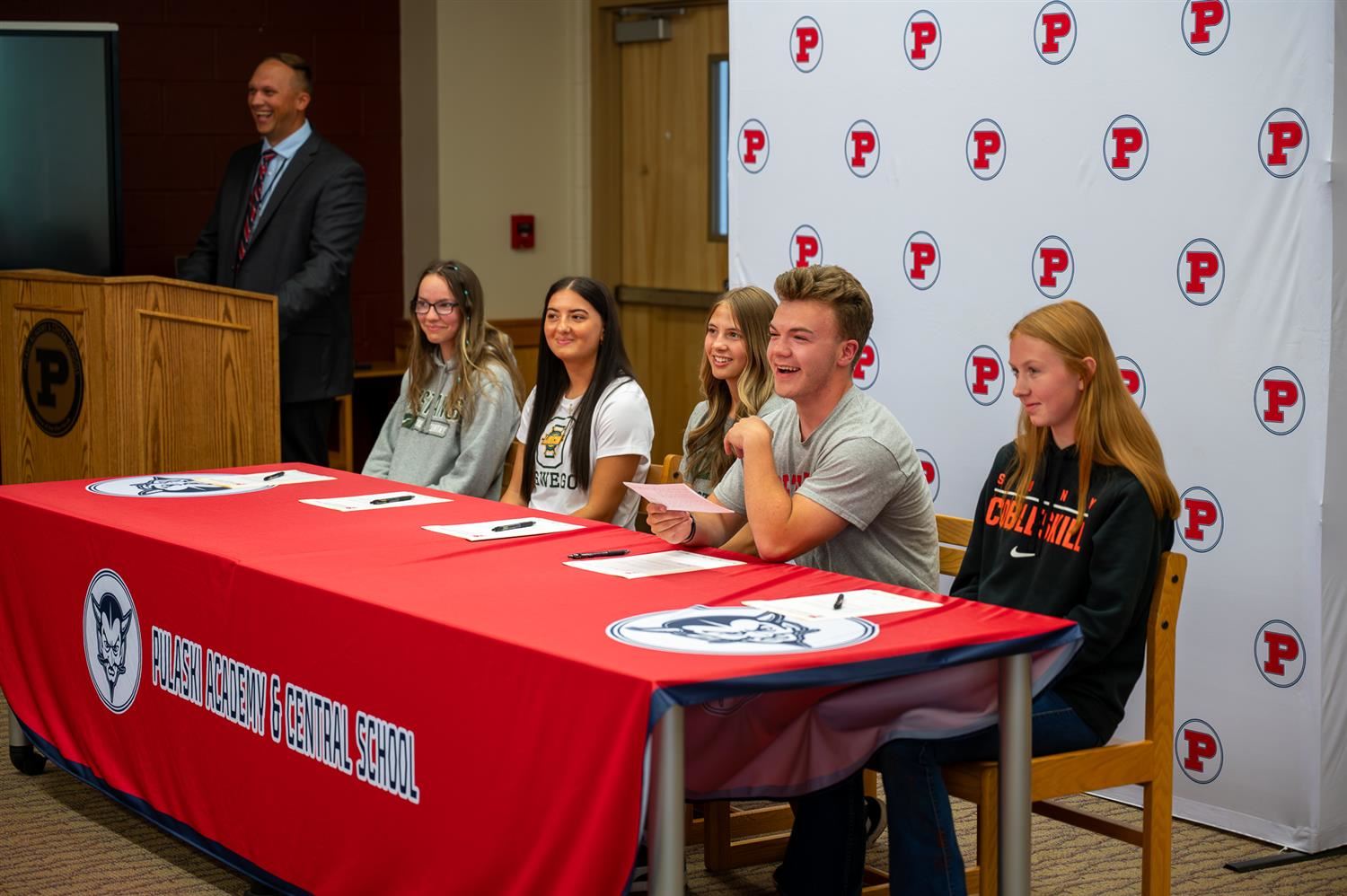 6 students at PACS signing their collegiate letters of intent.